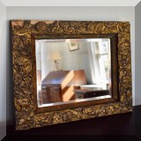 D22. Floral wall mirror. Some chipping. 18”h x 18”w - $20 